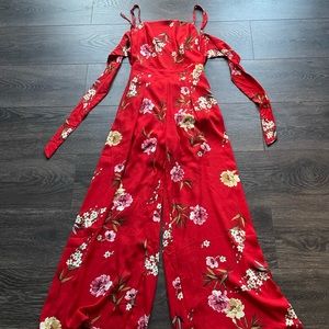Boutique floral red romper with open back!